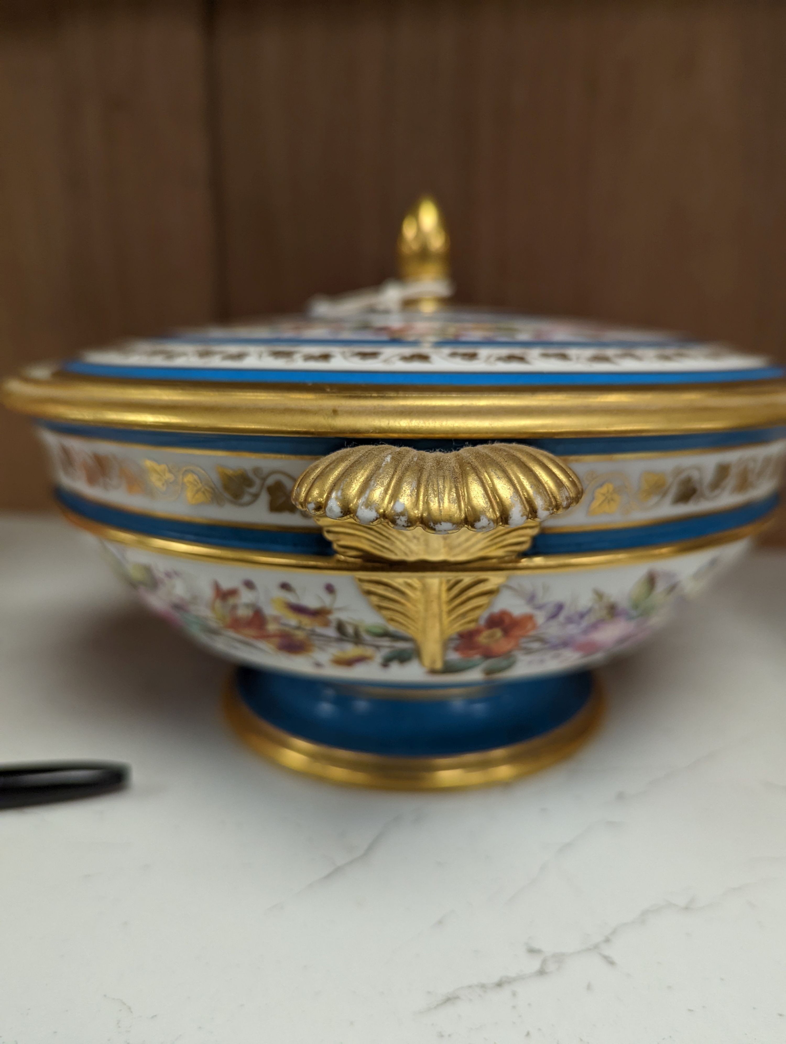 Sevres ecuelle and cover painted with a band of flowers surrounding the gilt monogram of Louis Phillipe, blue mark dated 1850, red mark for Chateau de Compiegne 25cm